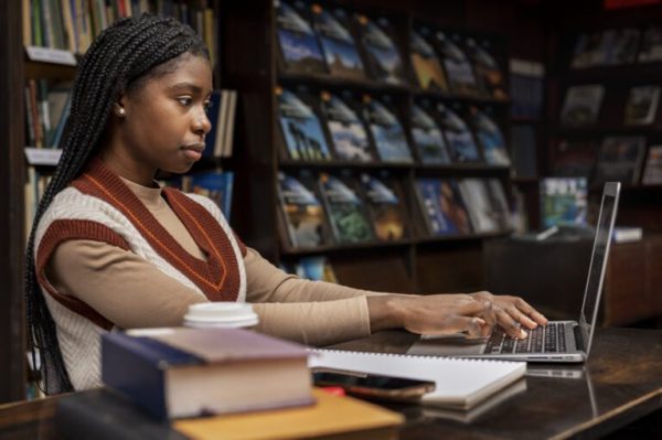 young-student-working-assignment-768x511